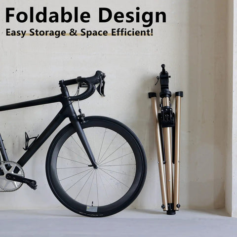 Folded Beefy Pro Grade Aluminum Bike Repair Stand next to bike for easy storage, focus on foldable design, space efficient.