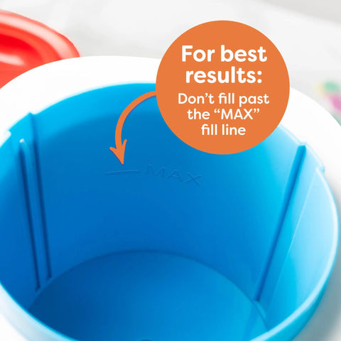 Inside view of Next Level Electric Shaved Ice And Snow Cone Maker showing blue container with MAX fill line indicator.
