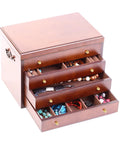 Wooden jewelry box with four open drawers displaying assorted jewelry and accessories, featuring brass handles and decorative knobs.