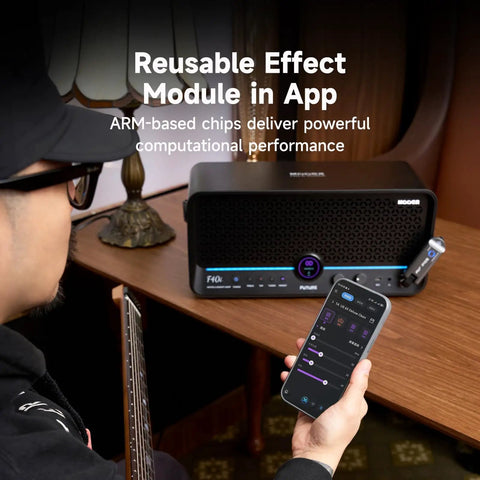 Musician with guitar using 40W Touchscreen Guitar Amp with Built In Audio Separator Looper Drummer Mode 6 Hour Battery on table