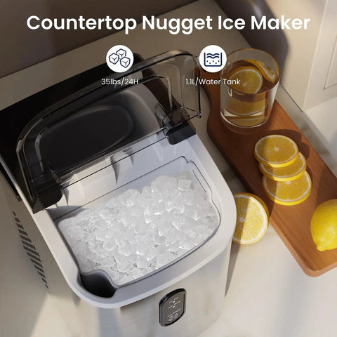 Crunchy Nugget Ice Maker For Countertop With Auto Cleaning 35 Lbs Per Day Portable Sonic Ice Machine filled with ice next to lemons.