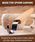Right Handed Spoon Carving Hook Knife, Slick Curved Whittling Blade For Kuksa Cups And Wooden Bowls displayed on wooden surface.