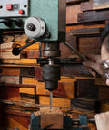 Heavy Duty Steel Drill Press Return Spring Assembly Featuring Replacement Quill Coil Spring For Bench Drill Machines in use on wood.