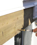 Person installing 10 X 3-1/8 Inch RSS Screws With Integrated Washer Head And Star Drive, Gold Finish, for wood bonding