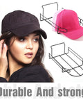Four Piece Metal Hat Display Racks for Slat Wall with pink and black caps, ideal for wall shelves and retail displays