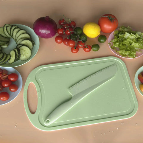 11 Inch Plastic Lettuce Knife With Serrated Blade To Keep Greens Kickin Fresh And Block Browning, Nonstick Safe For Cutting Cakes Fruits Bread, No Sweat Cleaning Dishwasher Ready Duo Pack In Crisp Green on a cutting board with fresh vegetables.