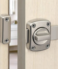 Tough As Nails Zinc Alloy Reversible Door Latch With Push Pull Bolt Lock installed on a wooden door for privacy and security.