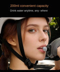 Person drinking from Hands Free Wrist Hydration Bottle 200ml Silicone Leak Proof Water Flask For Gym Running Cycling Hiking Climbing Jogging