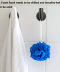 Four Pack Black Stainless Steel Towel Hooks Wall Mounted Heavy Duty Coat Robe Hanger with towel and loofah in bathroom