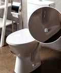 A white bathroom with a close-up of 32 Pack Universal Toilet Bolt Caps Plastic Round Push On Screw Covers With Extra Washers on toilet base.