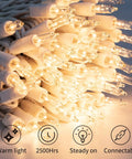 Warm White 50 Count Mini Christmas Lights On White Wire coiled showing warm glow and clear incandescent bulbs