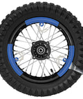 Honda Dirt Bike Tire And Inner Tube Set Front 2.50-14 Rear 3.00-12 durable tread on a blue-rimmed dirt bike wheel