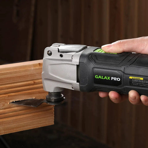 Power Packed Oscillating Multi Tool Kit With 2.4 Amp Motor, shown cutting wood with precision blade attachment.