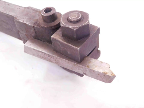 Four Piece Vintage Lathe Tool Holder Set Featuring Sick Precision Cutoff And Parting Turning Inserts, close-up of steel tool holder.