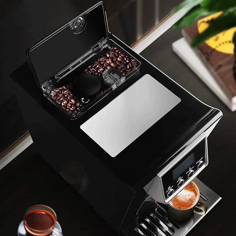 Fully Automatic Coffee Machine With Built In Burr Grinder And Grind And Brew System One Tap Espresso Maker 1200W Power Auto Clean Function For Healthier Brews Black shown from top angle with coffee beans visible