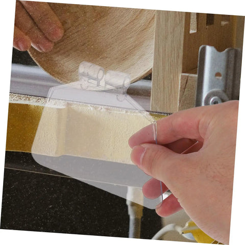 Hand installing Dustproof 6-Inch Bench Grinder Eye Shield Guard Kit, Reusable Eye Shields 2-Pack on grinding machine.