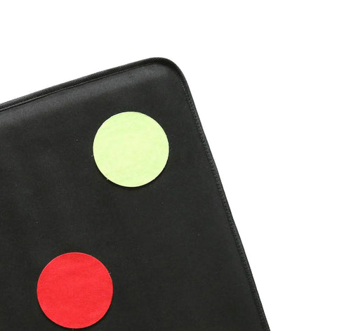 Close-up of Durable Microfiber Fencing Target With Bullseye For Saber Foil And Epee Self Training in black with red and green circles.