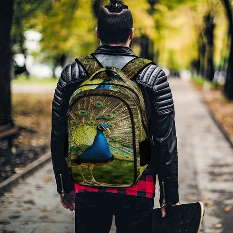 Man wearing Go To Everyday Carry Unisex Peacock Print Backpack With Full Tail Spread Design, Large Capacity Daypack in park
