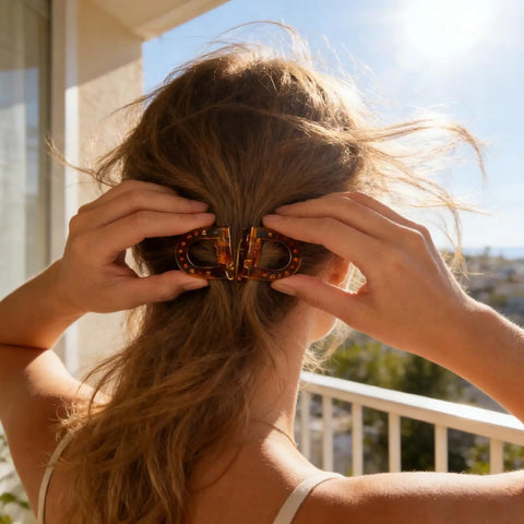 Woman using Magnetic Hair Clips For Women With Strong No Slip Hold Seamless 2 In 1 Design For Thick Or Thin Hair on balcony.