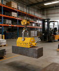 Kickass Heavy Duty Permanent Lifting Magnet With 11000 Lbs Capacity lifting a steel block in a workshop with crane setup.