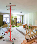 Heavy Duty Steel Drywall Lifter With Adjustable Height And Smooth Ride Casters For No Sweat Solo Ceiling Mounting and Plasterboard Hoisting in a busy renovation site.