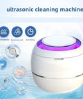 Sleek Ultrasonic Cleaner Kicks Deep Grime From Retainers Mouth Guards And Braces With Dual Modes for Jewelry Watches and Toys in a compact white pod.