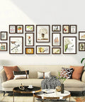 Living room art display with frames using Heavy Duty Picture Hanging Wire Kit With 110 Feet Braided Wire 60 D Ring Hangers Screws