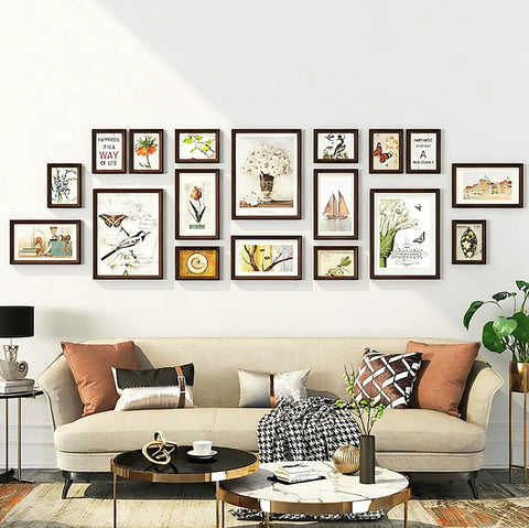 Living room art display with frames using Heavy Duty Picture Hanging Wire Kit With 110 Feet Braided Wire 60 D Ring Hangers Screws