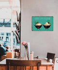Ramen Is My Valentine Metal Sign 8x12 Inch Tin Wall Decor in bright cafe, displayed on wall above table with flowers.