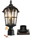 Hardwired 120V Dusk To Dawn Outdoor Post Light Black Roman Aluminum Pole Lamp With Pier Mount Base next to clear glass lantern.
