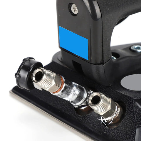 Heavy Duty Industrial Steam Iron With Automatic Full Press Boiler close-up of hose connectors and rugged base for commercial use