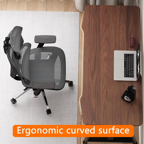 Level Up Your Home Office Game With This Rock Solid 55 Inch Manual Standing Desk Packed With A Pull Out Keyboard Tray And Four Easy Height Adjustments So You Can Switch Between Sitting And Standing Without Breaking A Sweat, showing a curved surface and ergonomic chair.