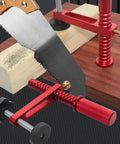 Heavy Duty Aluminum Workbench Clamps With 19mm And 20mm Holes Holdfasts holding wood with saw, red clamps on bench