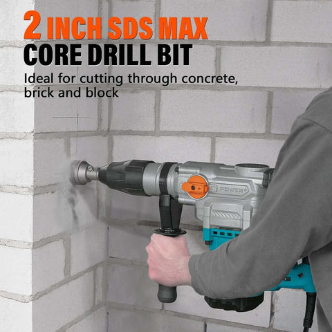 Side view of Berserker 2in x 9in SDS Max core drill bit on a rotary hammer drilling into a concrete block wall
