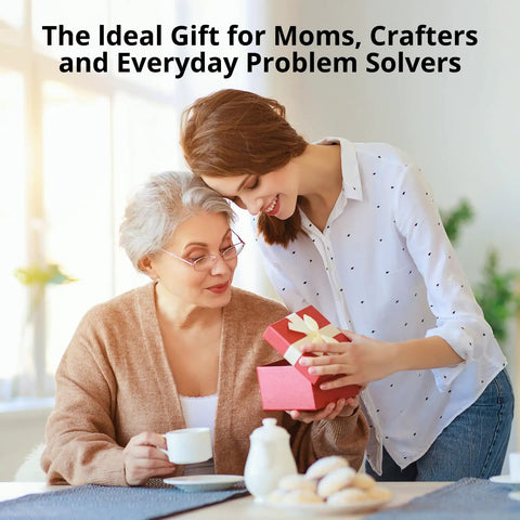 Two women at a table, one gifting a pink box to the other, with text saying 'The Ideal Gift for Moms, Crafters and Everyday Problem Solvers.'