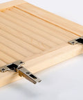Pro Grade Forstner Drill Bit Set With Custom Hinge Mounting Template Built To Bore Dead Center Twenty Six To Thirty Five Mm Holes shown on a wooden cabinet door with metal hinges.