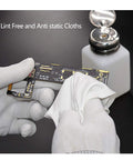 Cleanroom lint-free polyester wipe used on a circuit board by gloved hands.