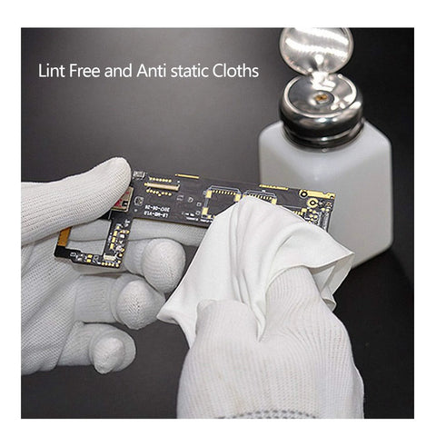 Cleanroom lint-free polyester wipe used on a circuit board by gloved hands.