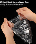 Two Hundred Piece Pack Of Slick Clear Heat Shrink Wrap Bags with hands showing the durable POF heat shrink film in use.