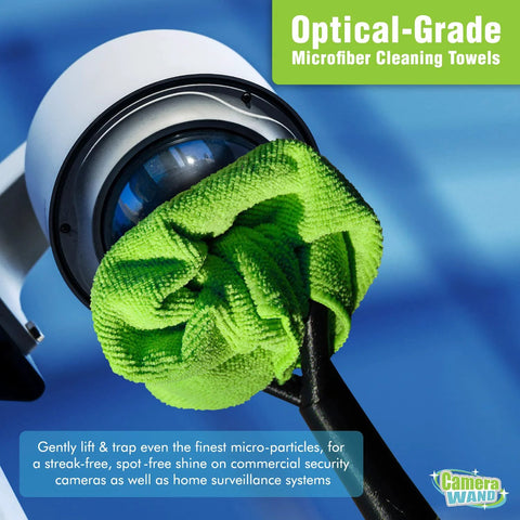 Camera lens cleaning tool with bright green microfiber towel wrapped around a security camera lens.