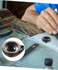 Pro Grade Mechanical Alarm Clock Repair Kit with precision springs and winding key on a workshop table