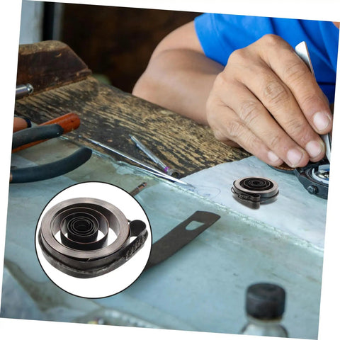 Pro Grade Mechanical Alarm Clock Repair Kit with precision springs and winding key on a workshop table