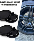 Upscale Black ABS Wheel Center Caps 4 Pack Snap In Rim Hub Covers For Trucks SUVs And Sedans OD 60MM ID 56MM on display with black rim.