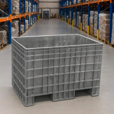 Dang Tough Heavy Duty Plastic Bulk Storage Tote, 42X29X28 Inch in gray, shown in a warehouse setting, ideal for heavy loads.