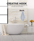 Creative wall hook with a towel hanging in a modern bathroom, featuring a simple design that complements décor.