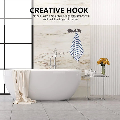 Creative wall hook with a towel hanging in a modern bathroom, featuring a simple design that complements décor.