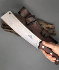 Person holding Beefy Dual Purpose Kitchen And Outdoor Cleaver For Bone Chopping And Bushcraft Wood Splitting Ultra Sharp 80 Degree Blade