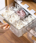 Adhesive Hanging Closet Rod Rack With Extra Sock And Underwear Dividers Straight Up keeps socks organized in clear drawer with gold handle.