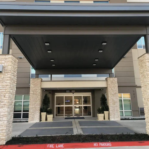 Building entrance with ceiling featuring Beast Bright Outdoor Canopy Light 45W LED Over 5100 Lumens Daylight 5000K AC110277V Energy Saver