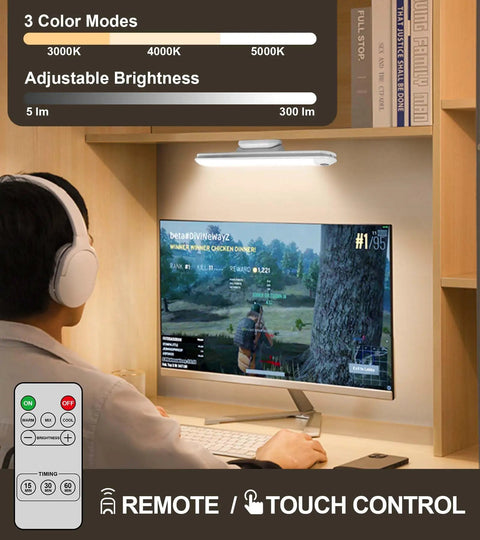 Rechargeable Touch Light Bar With Remote Dimmable LED for desk with computer monitor showing game, mounted above screen.